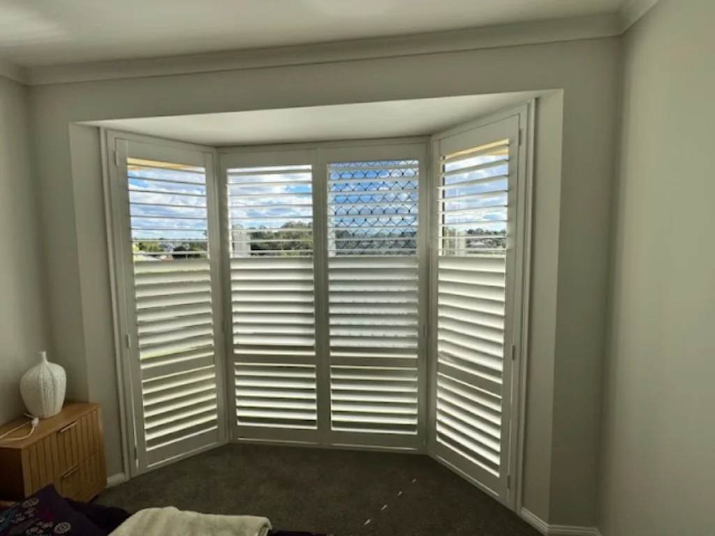 shutter-baywindow-underwood-hinged-1 — Shutter Hinged — loungeroom — shutters