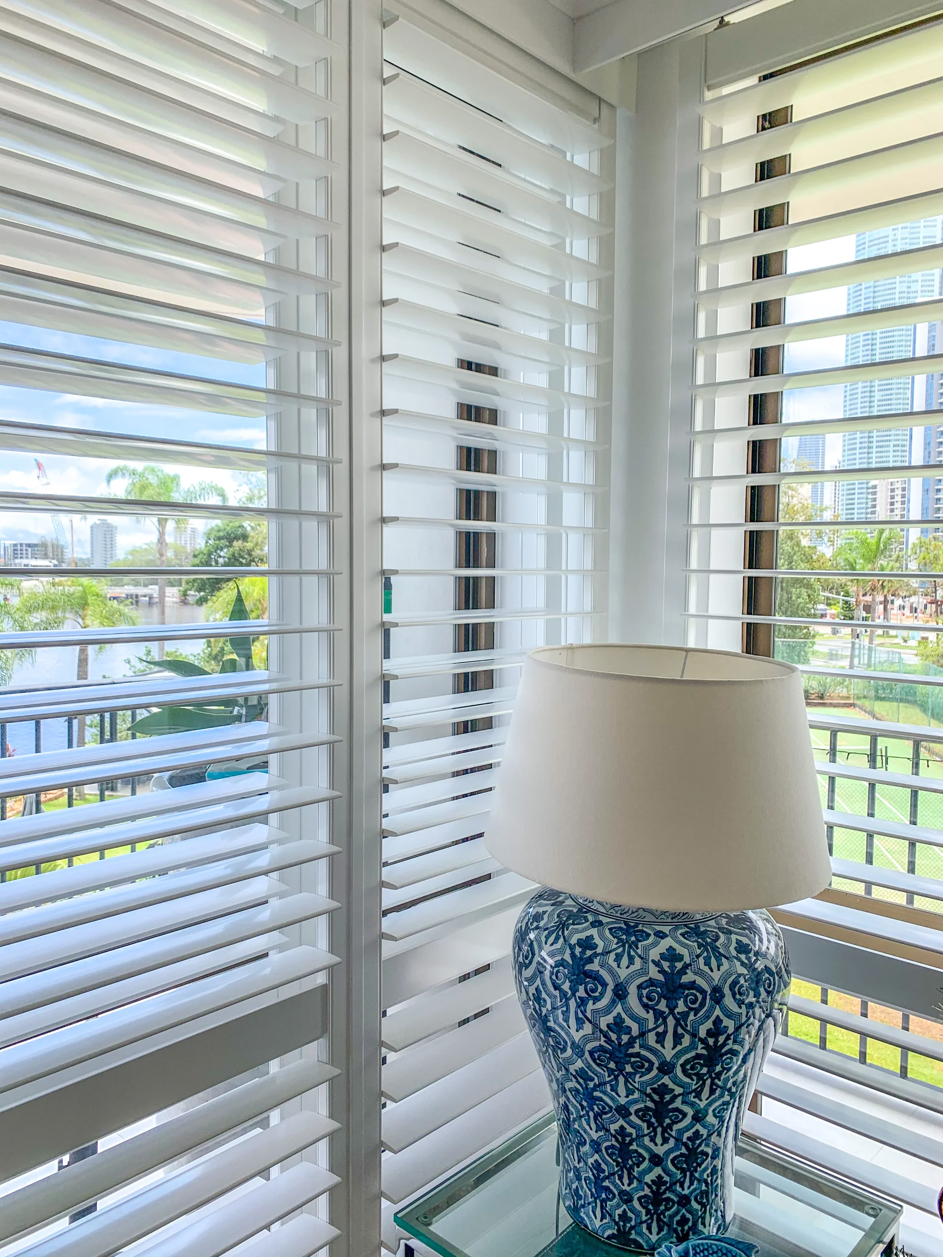 sliding-shutters-surfers-paradise-corner-1 — Shutter Sliding BB — living — shutters